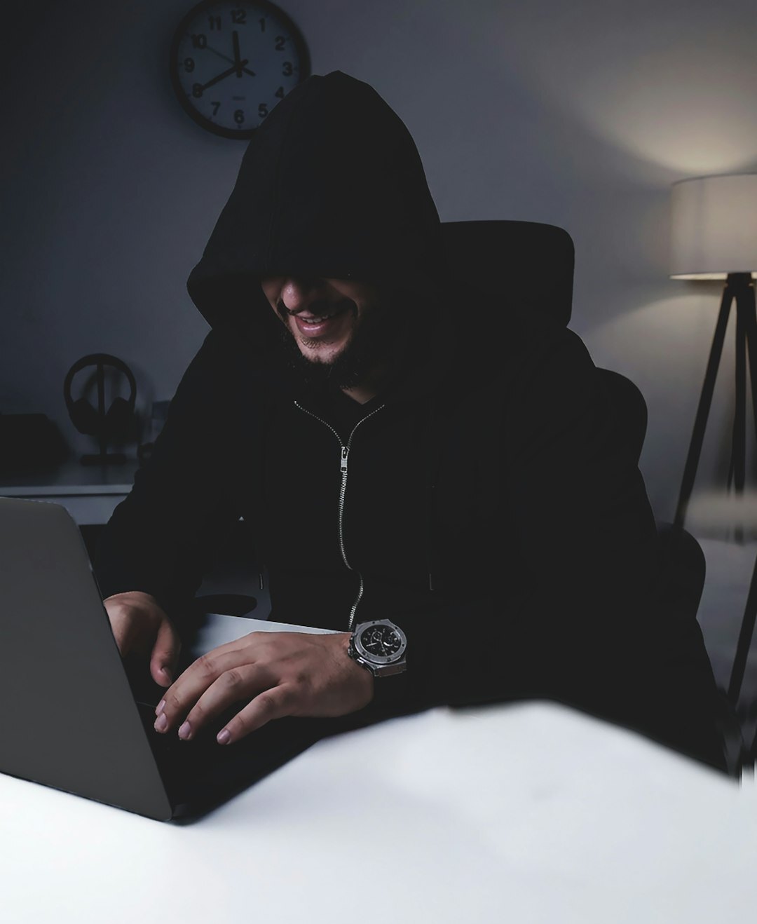 programmer coding on laptop