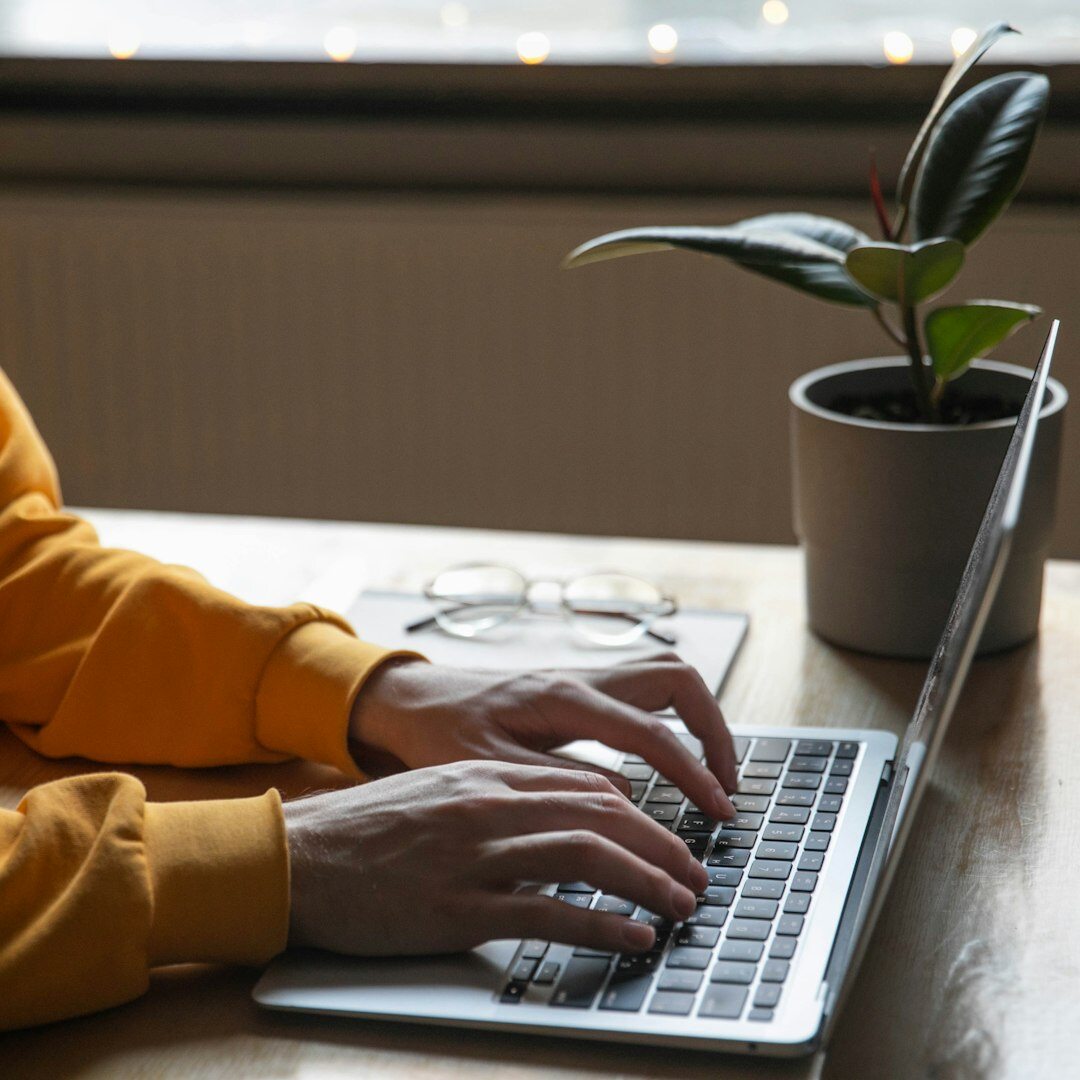 person studying with laptop at home