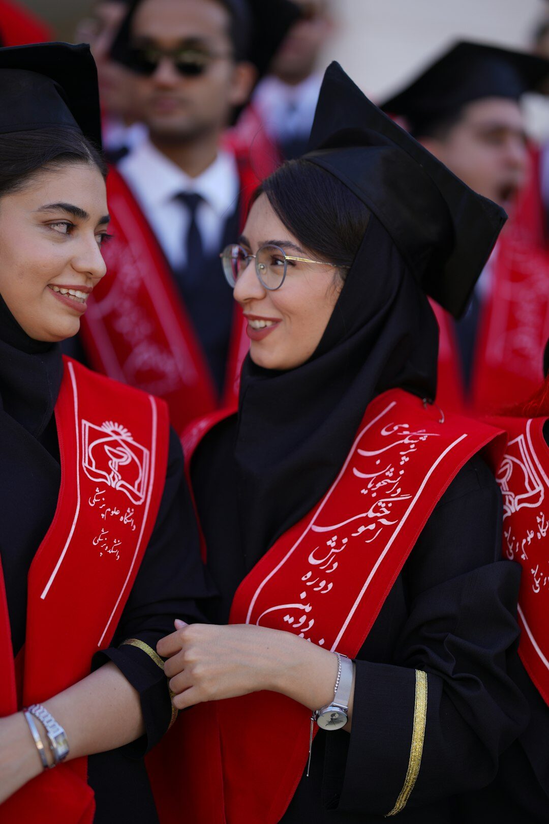 graduates smiling together